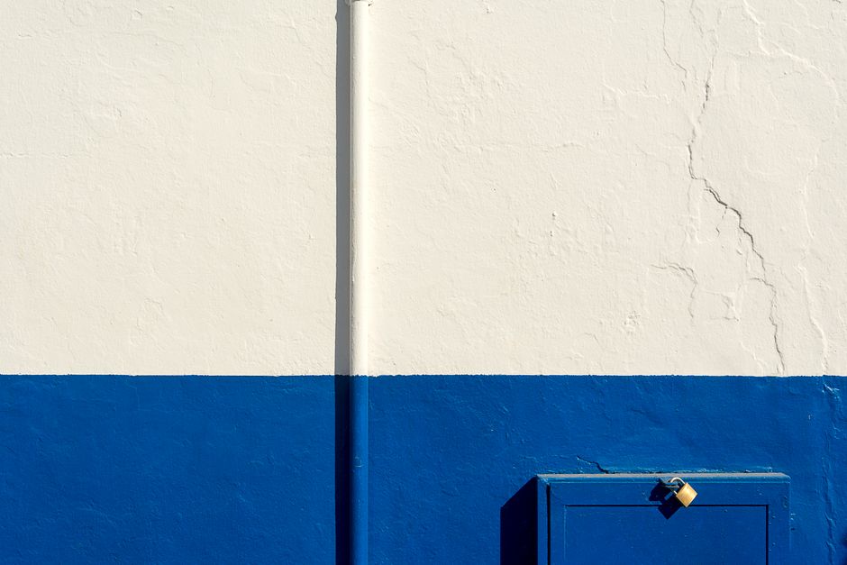 Plain white and blue painted wall.